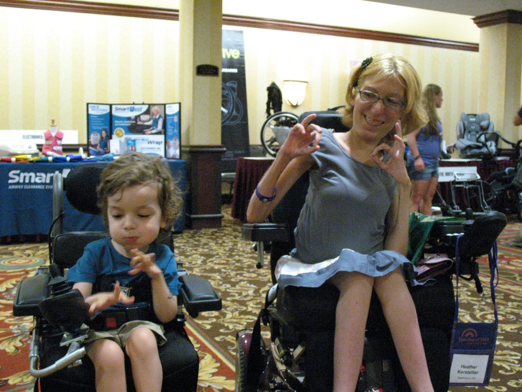 Oscar and Heather become fast pals at the conference. Seen here making the diver "OK" sign together!