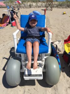 The beach wheelchair! Many public beaches have these available to use free of charge.