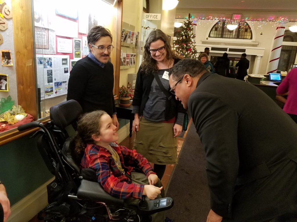 Here, Ken Morris, great great great grandson of Frederick Douglass (AND great great grandson of Booker T. Washington) greets Oscar. They had met back in April when Ken was in town, and became pals then. (Photo by Chris Christopher)